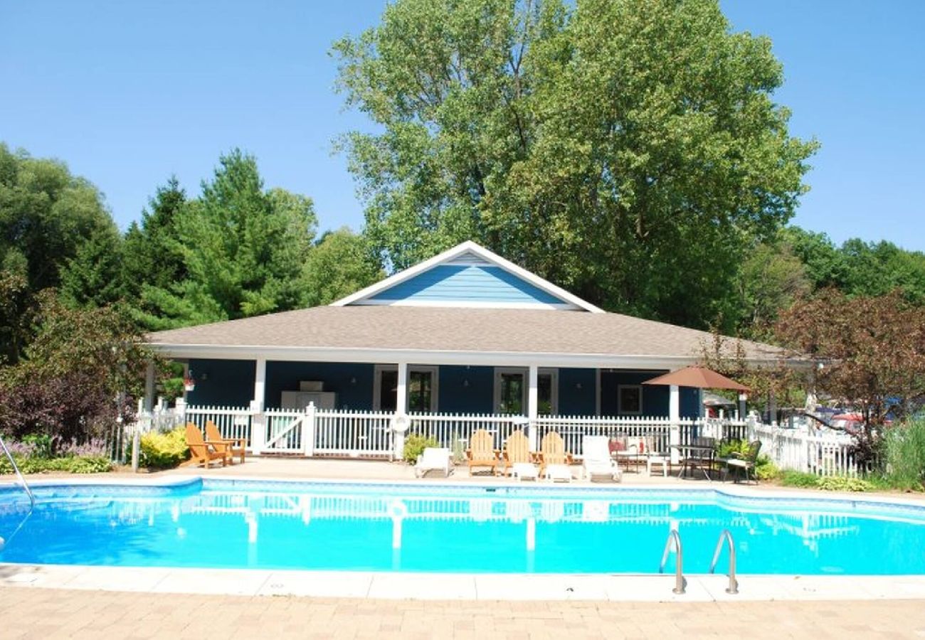 Outdoor pool and clubhouse at Woodland Harbor marina