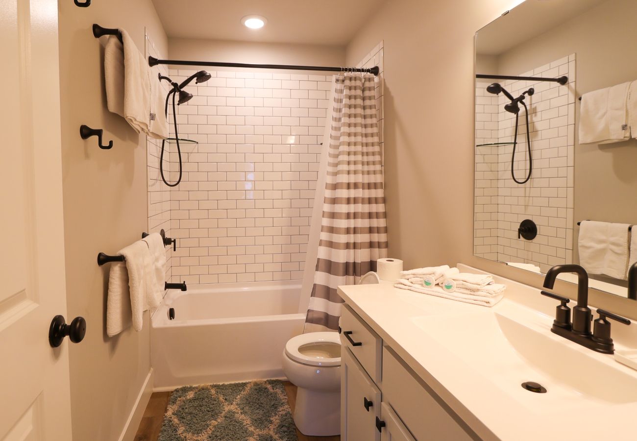 En-suite bathroom with subway-tile shower/tub