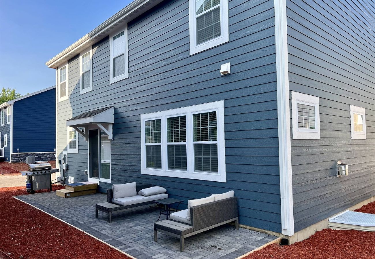 Patio with seating and a gas barbeque grill