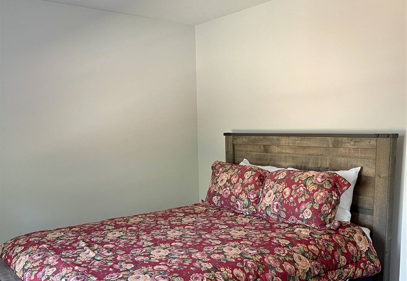 Bedroom with rustic wood bed frame 