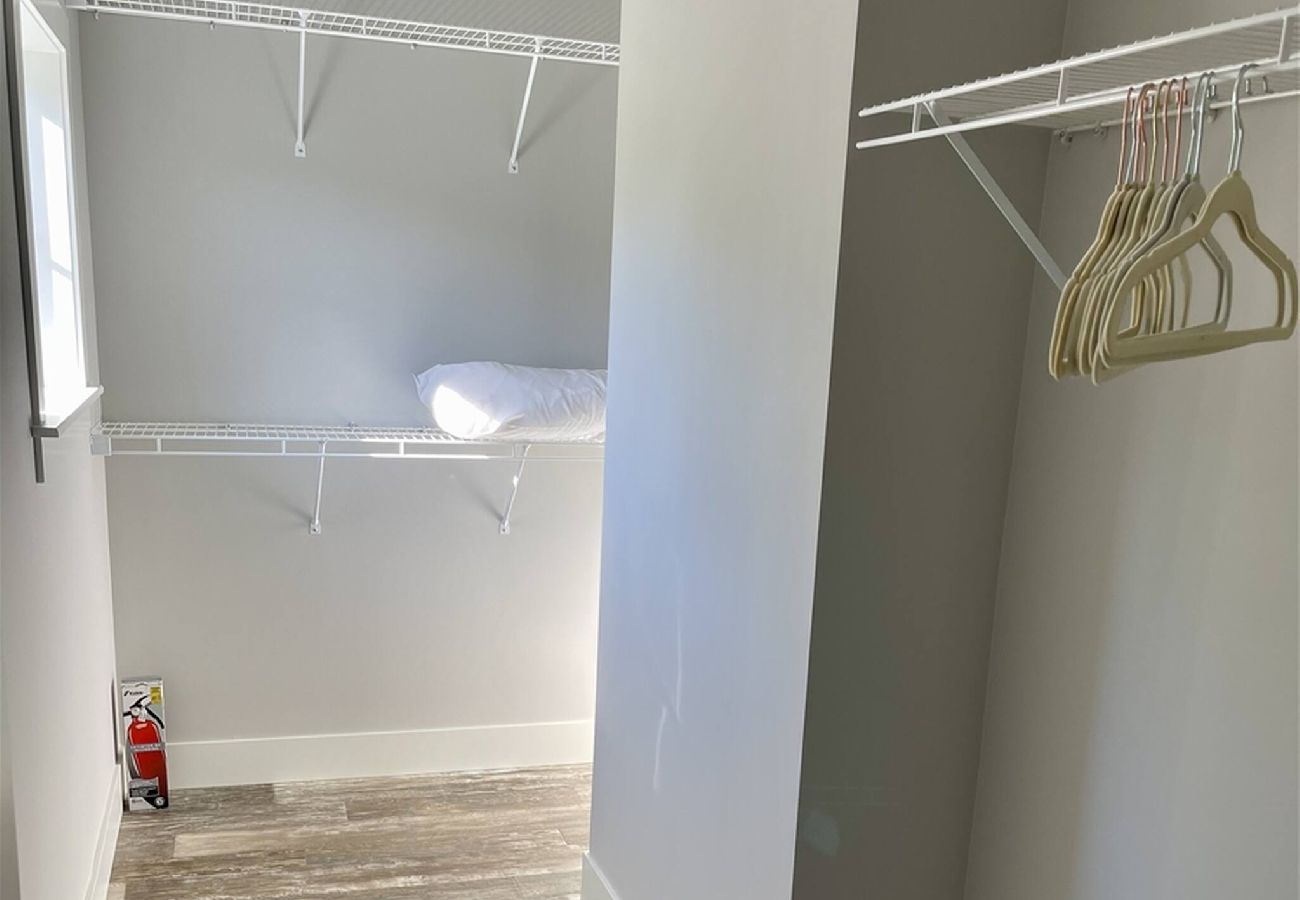 Walk-in closet with wire shelving 