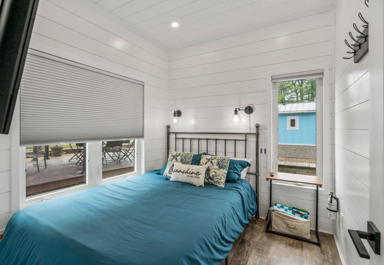 Queen bedroom and water views at Shoreside Haven