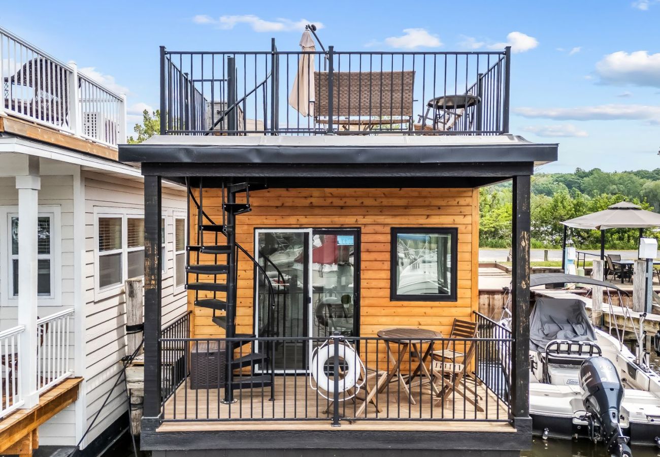 Shoreside Haven floating cottage with main-level waterfront deck  and spacious rooftop patio overlooking Woodland Harbor