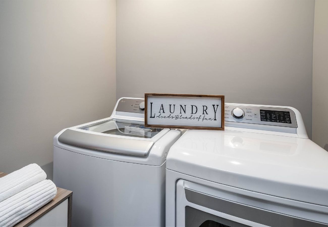 Laundry room featuring a white washer and dryer