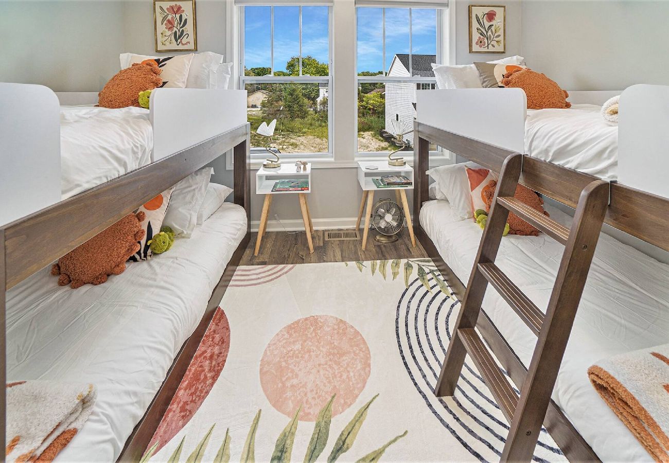 Colorful Kids Bedroom with two twin-over twin bunk beds and playful decor