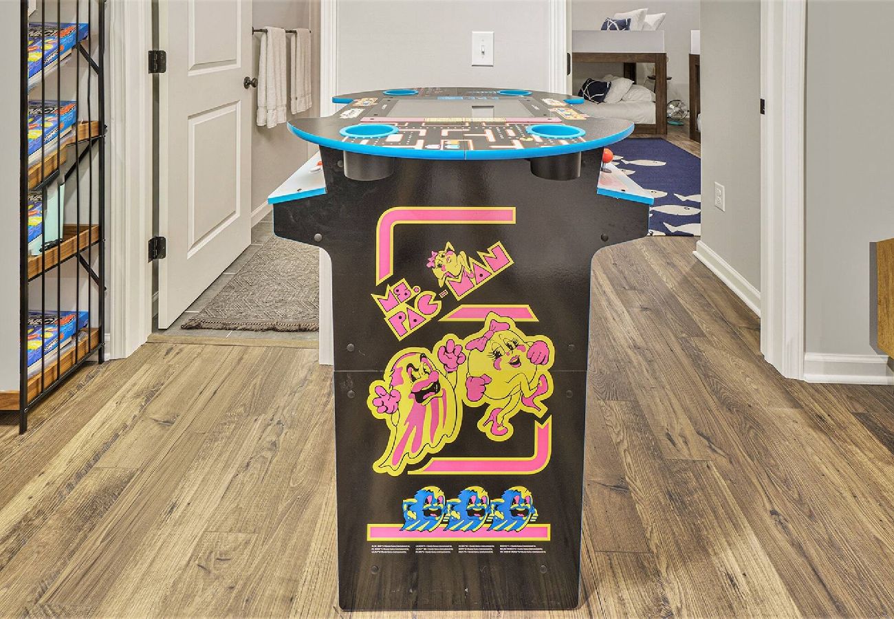 Ms. Pac-Man arcade table in basement game area