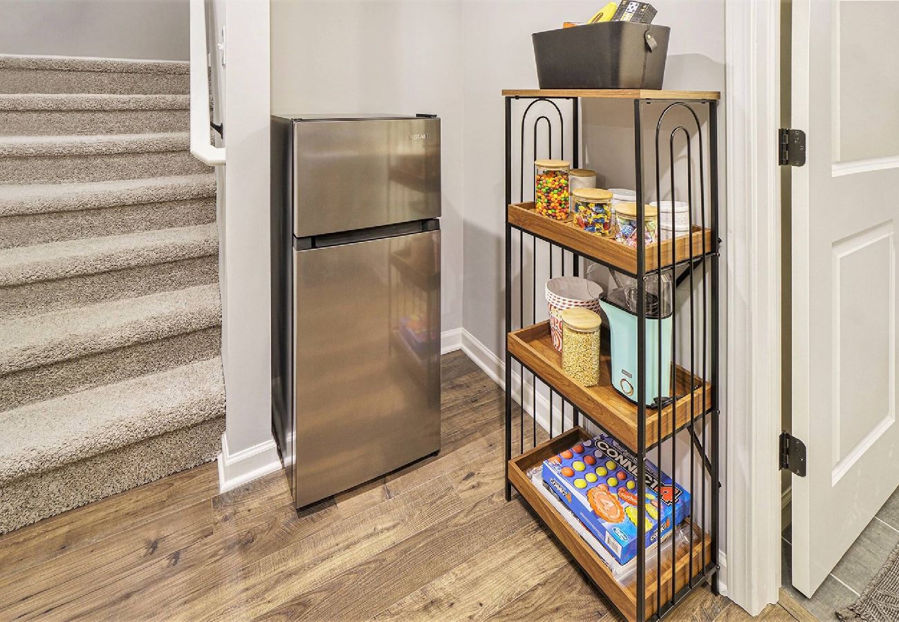 Basement landing with mini fridge and snack shelf