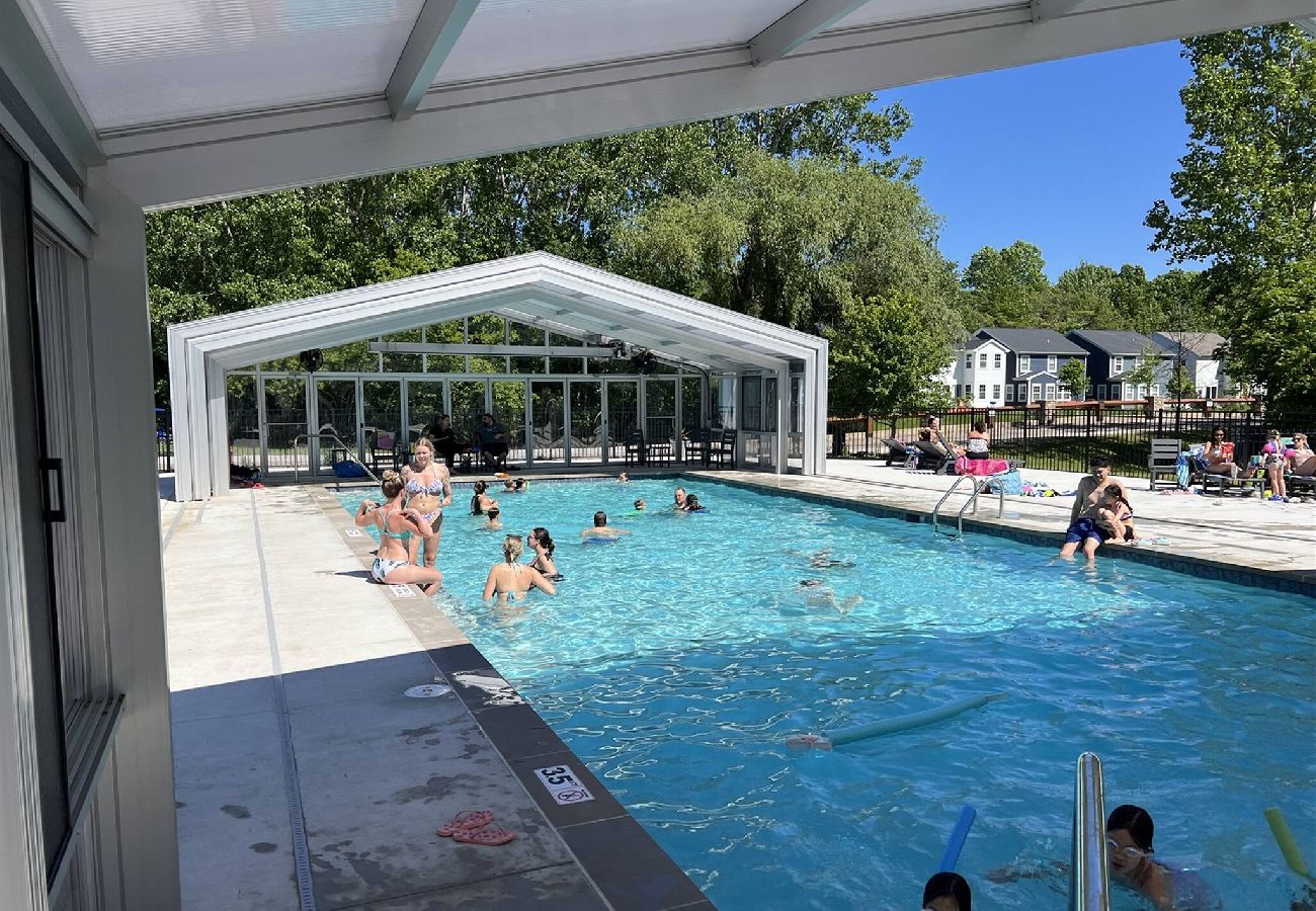 Large indoor outdoor pool with retractable enclosure at Harbor Club in South Haven MI